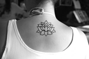 Tribal Lotus Flower Tattoo on Neck