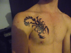 Tribal Scorpion Chest Tattoo