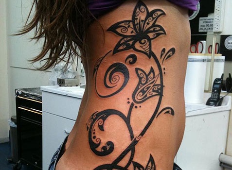 https://www.onlytribal.com/wp-content/uploads/2015/12/Tribal-Side-Tattoos.jpg