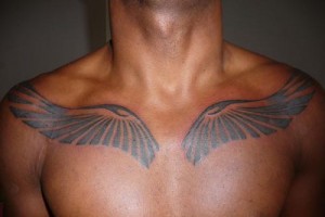 Tribal Wings Tattoo on Chest